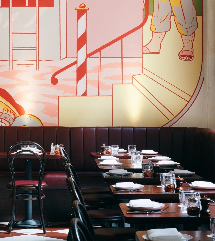 Art mural on a restaurant's back wall.